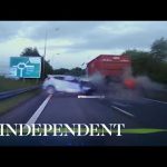 Car crash with truck on highway captured on dashcam.