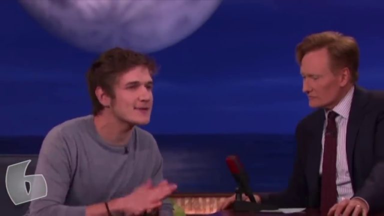 Two men having a conversation on TV set.