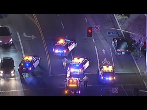 Police cars blocking intersection at night