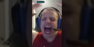 Person shouting while wearing a headset.