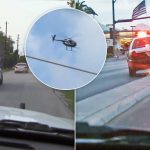 Police cars and helicopter in pursuit
