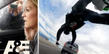 Woman recording outside car, man falls off SUV