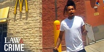 Person outside McDonald's restaurant, Law & Crime logo