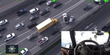 Aerial view of traffic and accident on highway.
