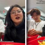 Two friends eating at a restaurant, laughing together.