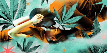 Couple kissing surrounded by cannabis leaves