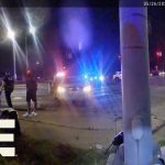 Emergency responders at night car accident scene.