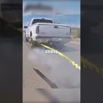 Truck towing with caution tape attached