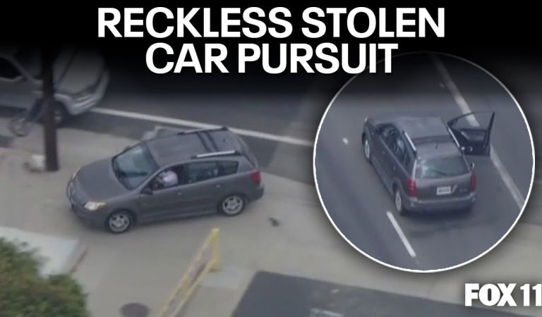 Wild police chase: Driver speeds with door open, drives on sidewalks