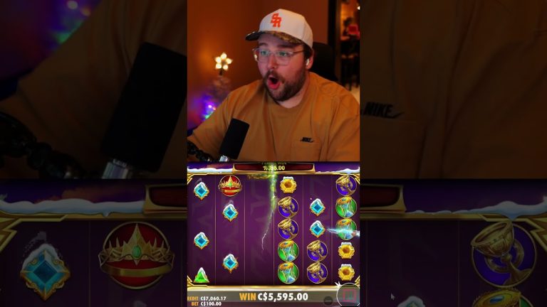Streamer reacts to big win in online slot game.