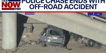 Car crash under bridge after police chase.