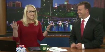 News anchors talking on TV studio set