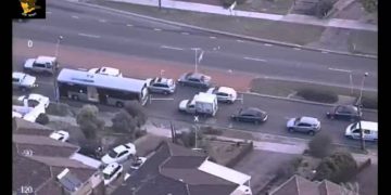 Aerial view of traffic on residential street.