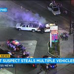 Police cars surround gas station during vehicle pursuit