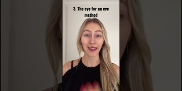 Woman explaining 'eye for an eye' method.