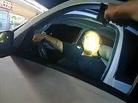 Person inside car during night police stop.