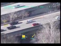 Helicopter footage of car chase on highway.