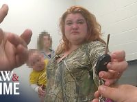 Woman handing keys to another person