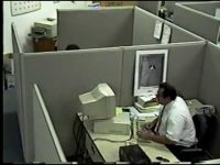 Office workspace with computer and cubicles.
