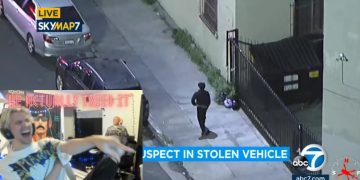Surveillance footage shows suspect near stolen vehicle.