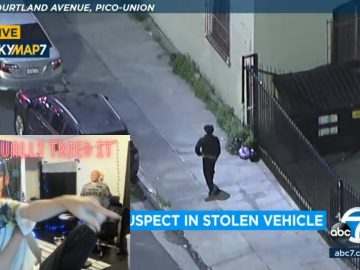 Surveillance footage shows suspect near stolen vehicle.