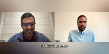 Two men video conferencing with captions.