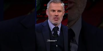 Man in suit speaking on TV broadcast