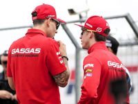 Two GASGAS riders conversing before a race.