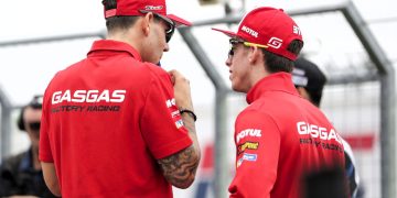 Two GASGAS riders conversing before a race.