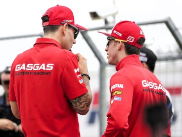 Two GASGAS riders conversing before a race.