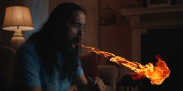 Person exhaling fire indoors