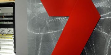 Red arrow on metallic textured background
