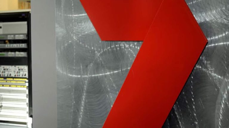 Red arrow on metallic textured background
