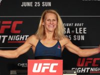 Smiling UFC fighter at weigh-in event.