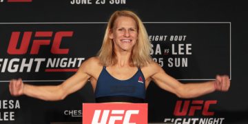 Smiling UFC fighter at weigh-in event.
