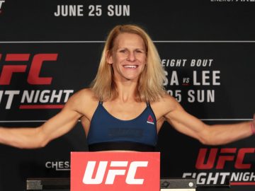 Smiling UFC fighter at weigh-in event.