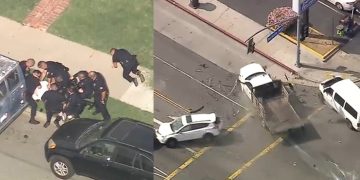 Police arrest suspect after car crash scene.