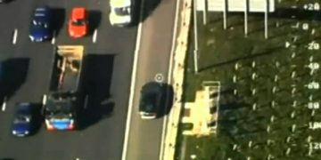 Aerial view of highway with traffic.