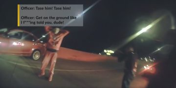 Police confrontation on road at night