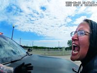 Person yelling near a law enforcement vehicle.