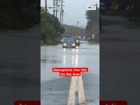 Flooding in Bay Area streets with cars submerged.