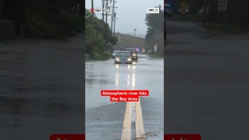 Flooding in Bay Area streets with cars submerged.