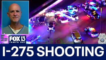 I-275 shooting scene with police vehicles and reporter.