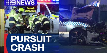 Emergency services respond to police car crash scene.