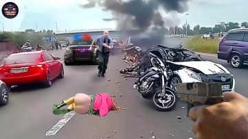 Car crash scene with police and burning wreckage.