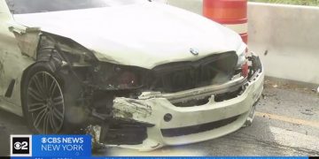 Damaged white car after a traffic accident.