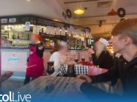Diners in busy themed restaurant with playful atmosphere.