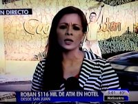 Reporter on TV, discussing ATM robbery news.