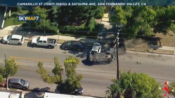 Aerial view of a police car chase on street.