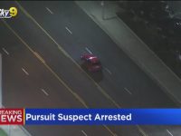 Aerial view of a police car chase suspect arrested.